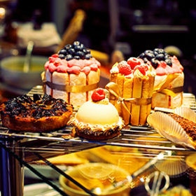 cakes and sweets in a shop window