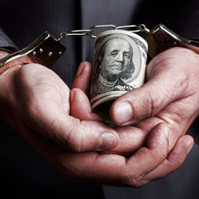 Business man in handcuffs arrested for bribe