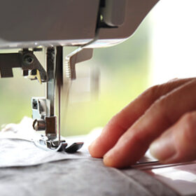Sewing machine stitching on fabric