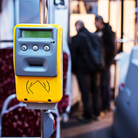 Ticket validator in modern city bus. Public transport