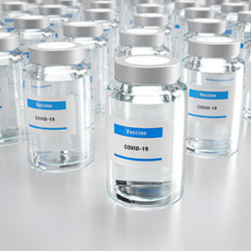 3d Illustration with rows of glass vials containing Covid-19 vaccine