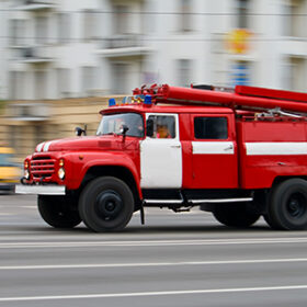 red fire-engine car in motion