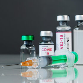 syringe injection medical and coronavirus covid-19 vaccine bottles