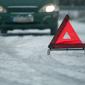 car breakdown with warning triangle on the road
