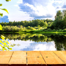 Forest lake and wooden board background. Can be used as background