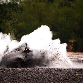 mud volcano with bursting bubble bledug kuwu. volcanic plateau with geothermal activity and geysers, slow motion Indonesia java. volcanic landscape