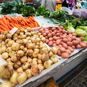 market stand selling several vegetables